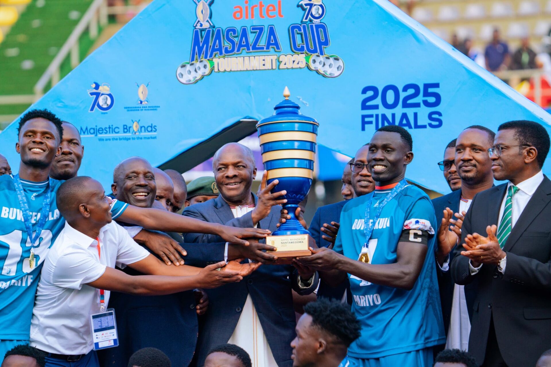 Winning coach Kawooya Felix Ssekabuuza reels away in celebration after guiding Buwekula to their maiden Masaza cup tittle 2025.