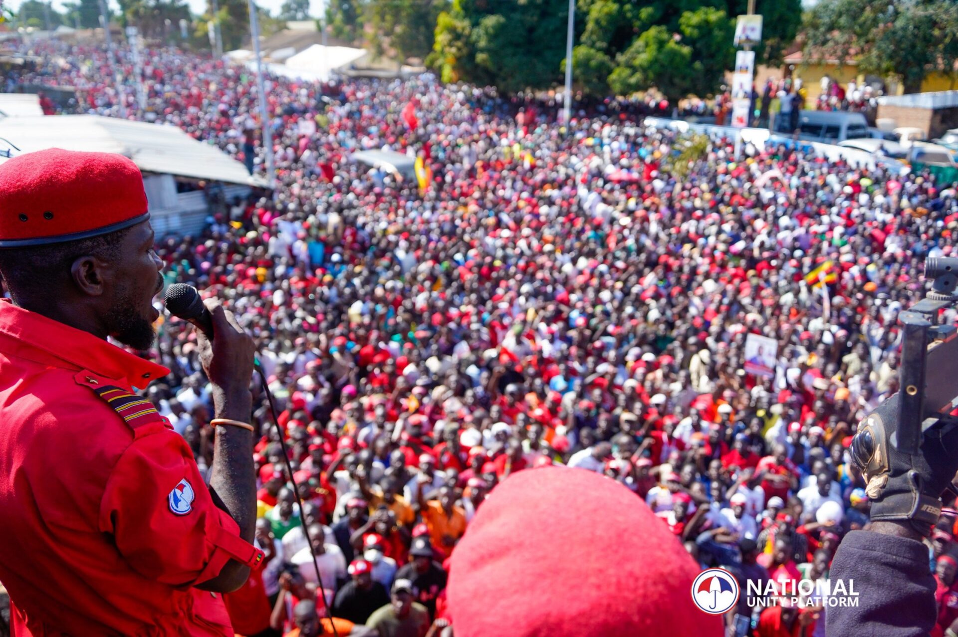 Bobi Wine speaking passionately to a large crowd at a People Power rally in Uganda